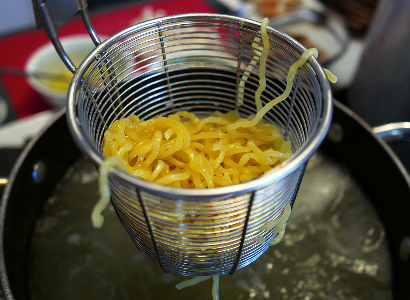 Straining ramen noodles