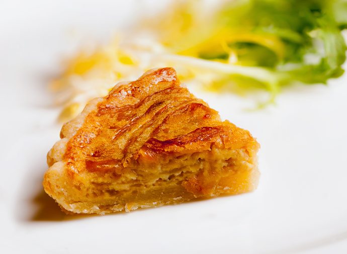 French Onion Tart Garnished with Crème Fraîche