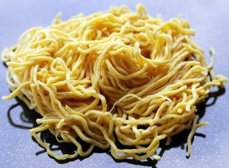 A pile of uncooked ramen noodles
