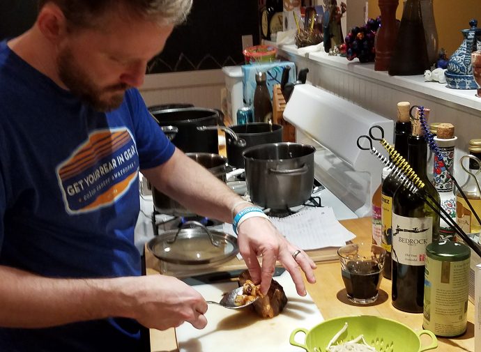 Justin Assembling ramen bowl