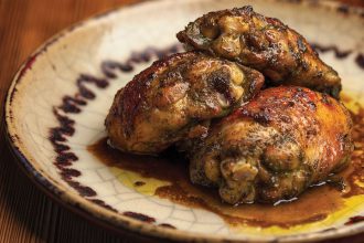Chang Mai Style Grilled Chicken on a plate.