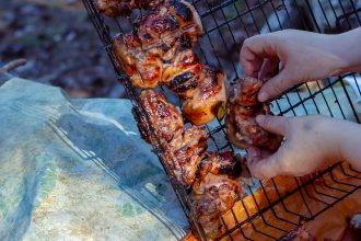 Jerk chicken being prepared for the grill.