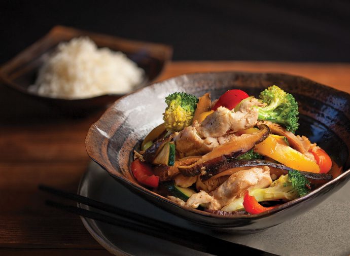 Bowl of stir fried chicken.